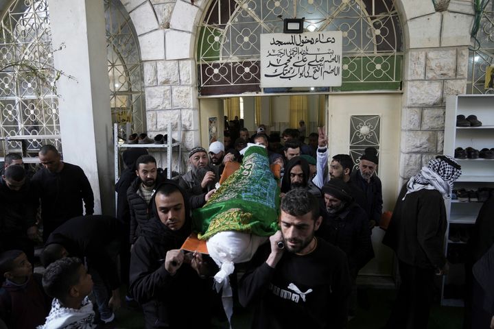 Mourners carry the body of Nassim Abu Fouda, 26, during his funeral in the West Bank city of Hebron, on Jan. 30, 2023. Israeli forces shot and killed the Palestinian man in the flashpoint city in the occupied West Bank on Monday, the Palestinian Health Ministry said. The killing marks the latest bloodshed in spiraling violence that comes as U.S. Secretary of State Antony Blinken visits the region. 