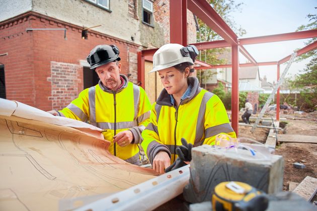 A young trainee building surveyor with her colleague