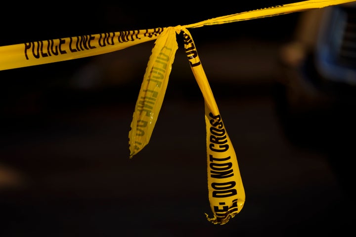 Police tape cordons tied together.