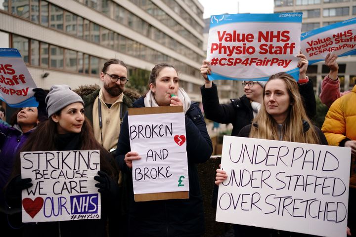 Members of the Chartered Society of Physiotherapy (CSP) on the picket line outside London's St Thomas' Hospital as they go on strike for the first time over pay.