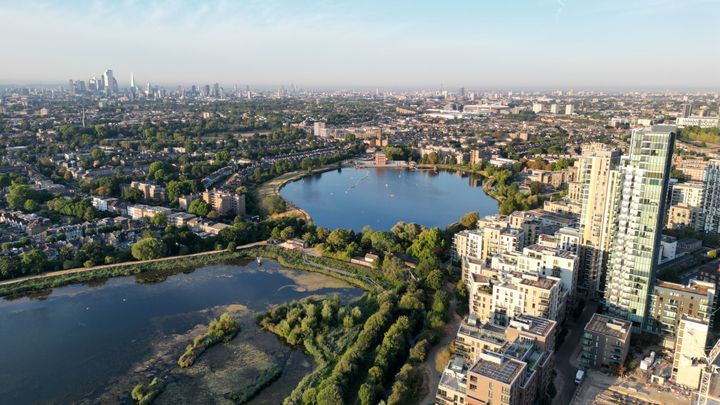 Aerial view of the East and West Reservoir in Hackney with the City of London visible on the horizon