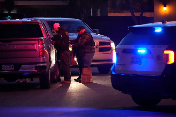 Las Vegas police work near the North Las Vegas home of former actor Nathan Chasing Horse during a raid.