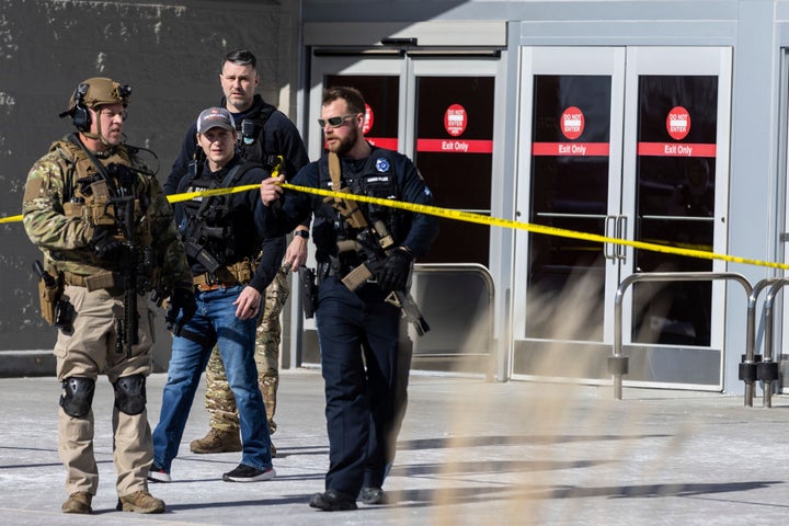 Law enforcement officers are pictured at the scene of a reported shooting at a Target store in Omaha, Neb., on Jan. 31, 2023. Omaha Police Chief Todd R. Schmaderer says city police confronted and shot a man with an assault rifle.