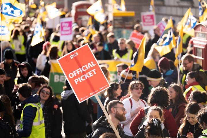 Around 100,000 civil servants are on strike in a dispute over jobs, pay and conditions.