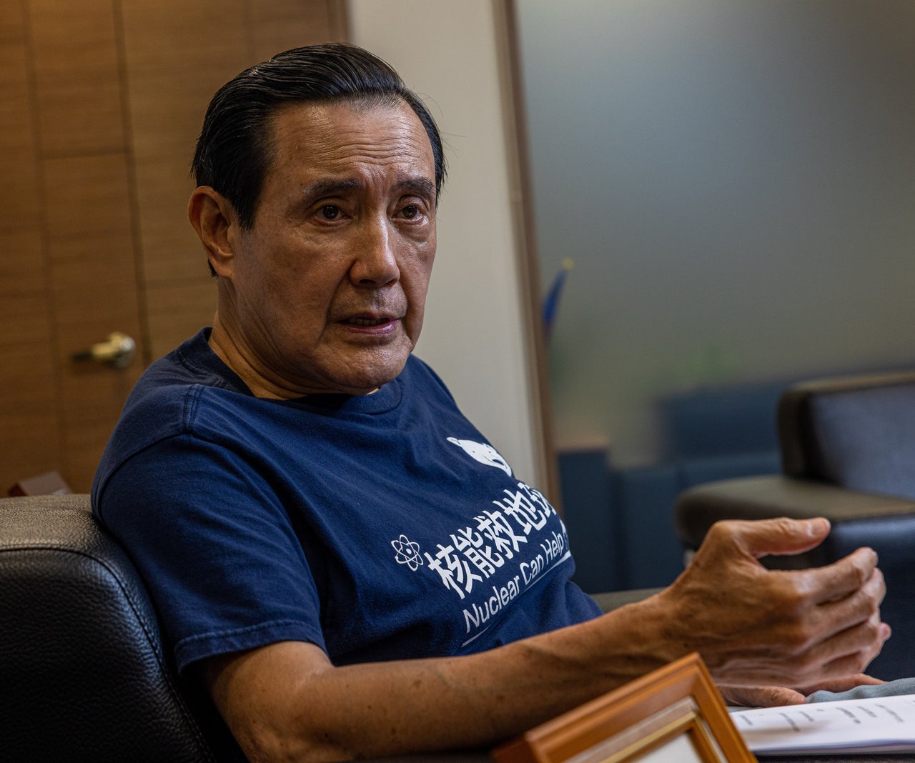 Former Taiwan President Ma Ying-jeou, interviewed on Nov. 23 in Taipei, said he wears this T-shirt, with the logo "Nuclear can help," because he believes nuclear plants can meet Taiwan's power needs with technology that's better for the environment.