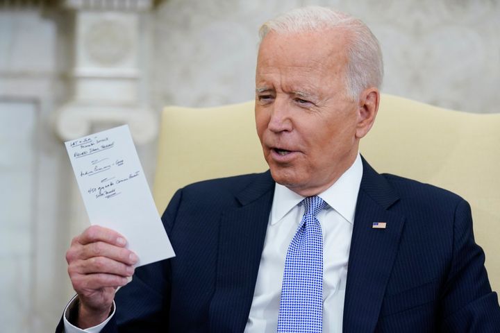 President Joe Biden holds notes as he meets with Indian Prime Minister Narendra Modi in the Oval Office of the White House, Sept. 24, 2021, in Washington. Biden is a man who writes down his thoughts.
