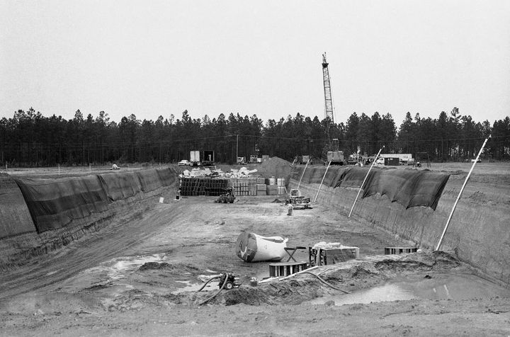 A photo from 1982 shows the 100-foot-wide, 850-foot-long and 22-foot-deep sand and clay orifice in Barnwell, South Carolina, that serves as the burial site for nuclear waste material transported from other areas. 