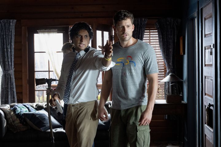 Aldridge (right, with director M. Night Shyamalan) hopes "Knock at the Cabin" will help offer the kind of LGBTQ representation he felt was missing in his early years as an actor.