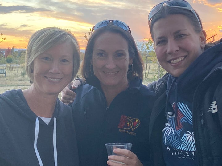 The author (left) with two friends at her 50th birthday party. She asked people to wear a hoodie, her favorite item of clothing.