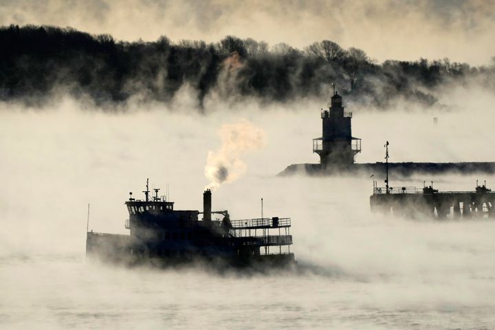 Arctic sea smoke rises from the the Atlantic Ocean as a passenger ferry passes Spring Point Ledge Light, Saturday, Feb. 4, 2023, off the coast of South Portland, Maine.