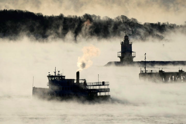 Arctic sea smoke rises from the the Atlantic Ocean as a passenger ferry passes Spring Point Ledge Light, Saturday, Feb. 4, 2023, off the coast of South Portland, Maine.