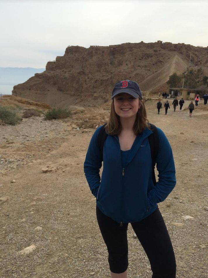 The author standing at the foot of Masada mountain in Israel before hiking to the top, where she had her bat mitzvah ceremony.