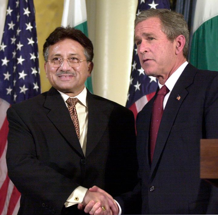 Then-U.S. President George W. Bush, right, shakes hands with then-Pakistani President Pervez Musharraf at a news conference at New York's Waldorf - Astoria Hotel, on Nov. 10, 2001. (AP Photo/Ed Bailey, File)