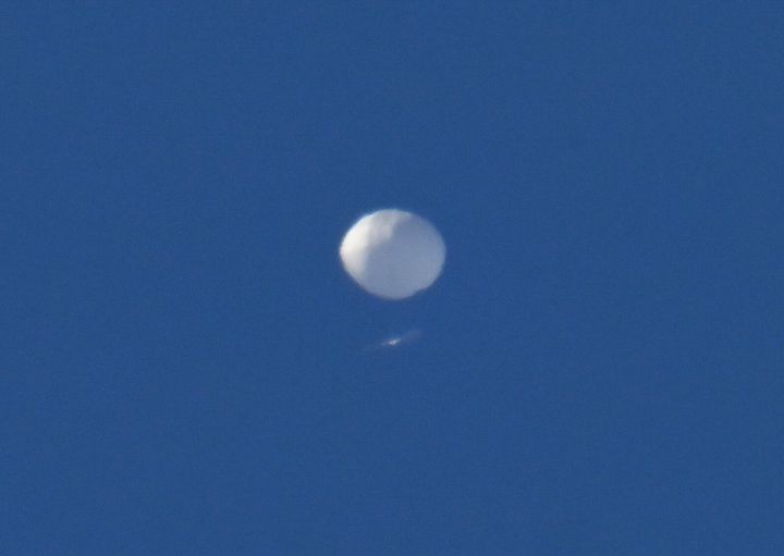 A suspected Chinese spy balloon is seen flying over Charlotte, North Carolina, on Saturday. The balloon was later shot down over the ocean.