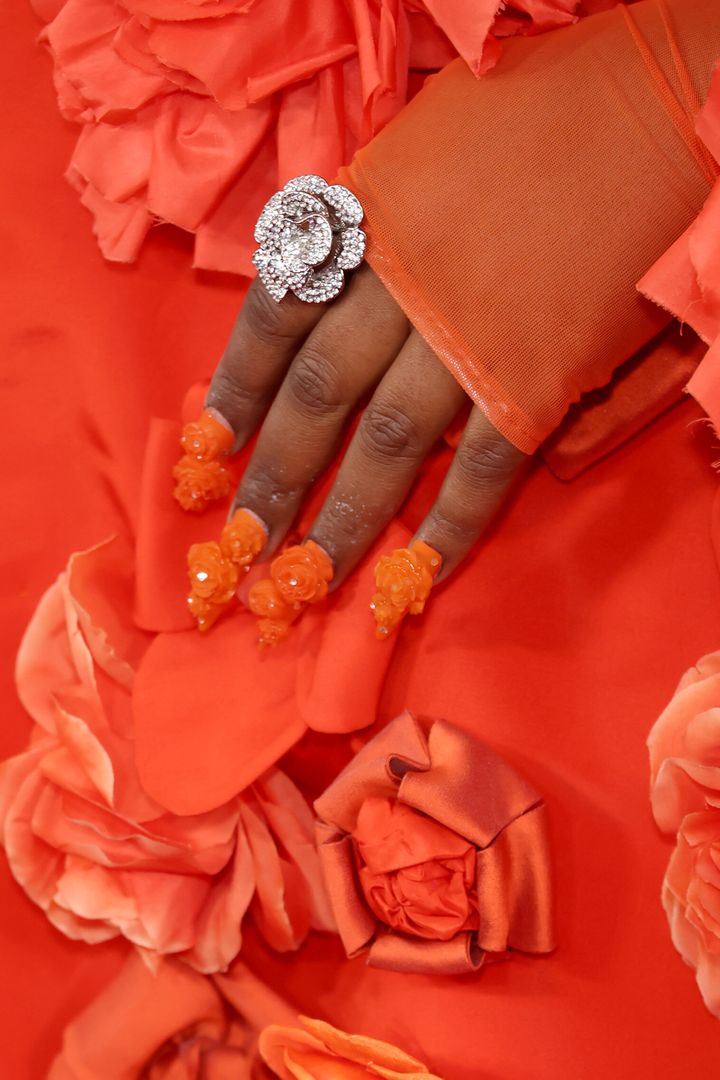 A close-up look at Lizzo's jewelry.