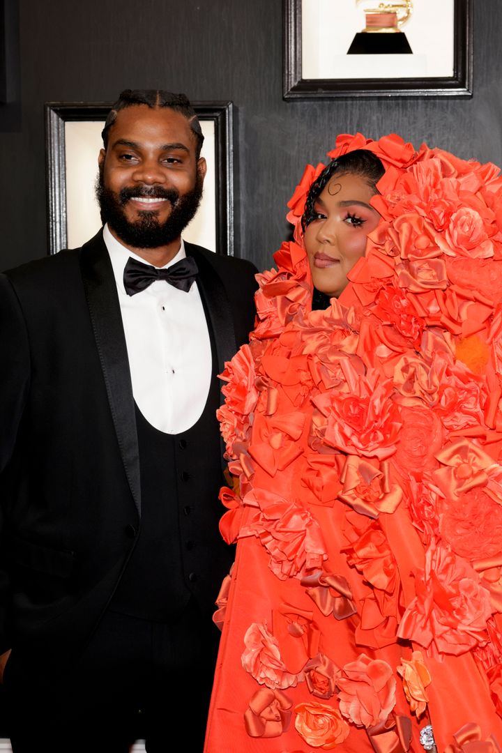 Myke Wright and Lizzo arrive at the Grammy Awards.