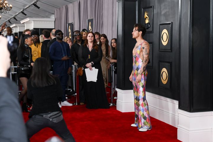 Harry Styles poses for photographers on his way into the Grammys