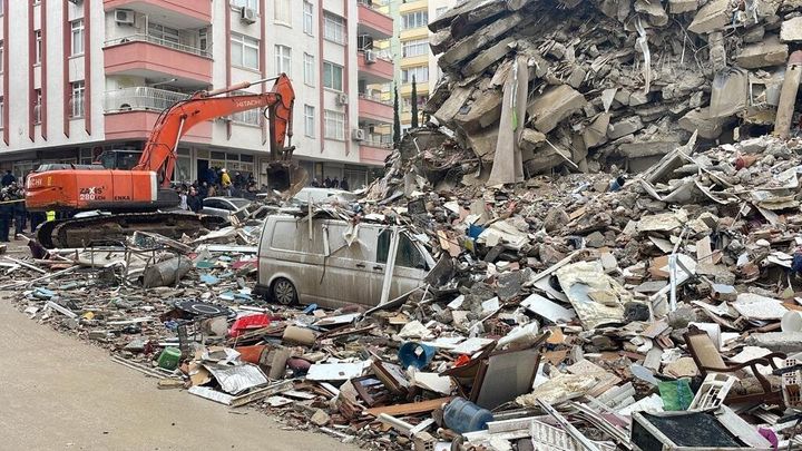 A view of a collapsed building as search and rescue works continue in Adana, Turkey, after a powerful earthquake hit the southern provinces of the country, on Feb. 6, 2023. 