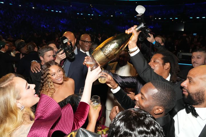 Adele, Beyoncé, Jay-Z, and Rich Paul celebrate at the Grammys. 