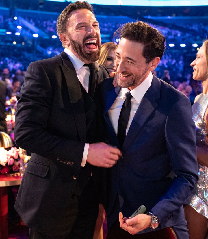 "Sad Affleck" looked anything but when photographed with Adrien Brody on Sunday night. 
