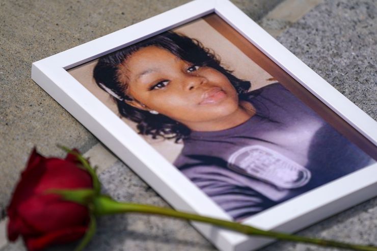A photo of Breonna Taylor is seen among other photos of women who have lost their lives as a result of violence during the 2nd annual Defend Black Women March on July 30, 2022, in Black Lives Matter Plaza in Washington. Taylor was killed in a police raid on her apartment in Louisville, Kentucky, in 2020.