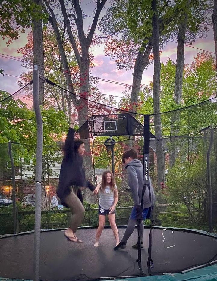 The author with her children jumping on a trampoline on her 40th birthday. "I highly recommend this for any tired single parent," she writes.