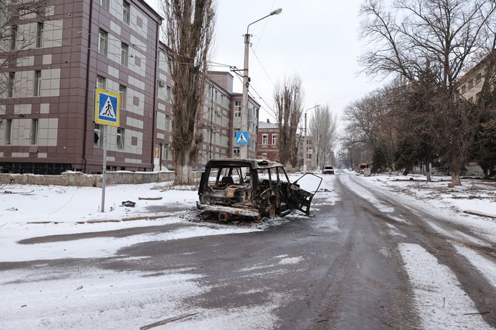 BAKHMUT, UKRAINE - FEBRUARY 06: A burned car on the road as the Russia-Ukraine war continues in Bakhmut, Ukraine on February 06, 2023. (Photo by Yevhen Titov/Anadolu Agency via Getty Images)
