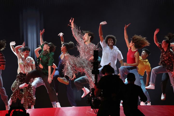 Harry Styles throwing shapes on stage at the Grammys