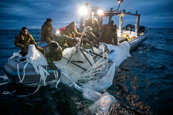 This image provided by the U.S. Navy shows sailors assigned to Explosive Ordnance Disposal Group 2 recovering a high-altitude surveillance balloon off the coast of Myrtle Beach on Feb. 5. 