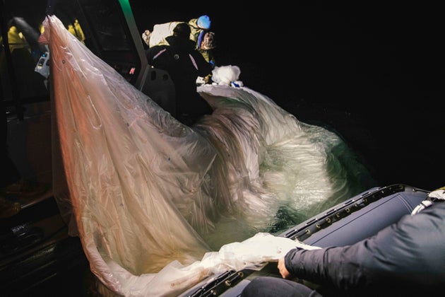 Sailors assigned to Explosive Ordnance Disposal Group 2 recover a high-altitude surveillance balloon on Feb. 5.