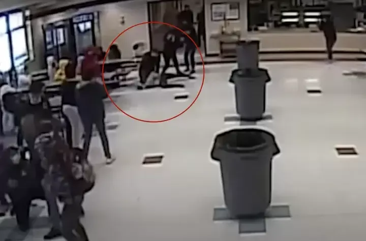 Surveillance video released by the Kenosha Unified School District last year shows off-duty Kenosha officer Shawn Guetschow restraining a girl with his knee on her neck during the March 4, 2022 incident.