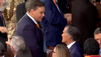 Sen. Mitt Romney and Rep. George Santos exchange words before President Joe Biden's State of the Union address.