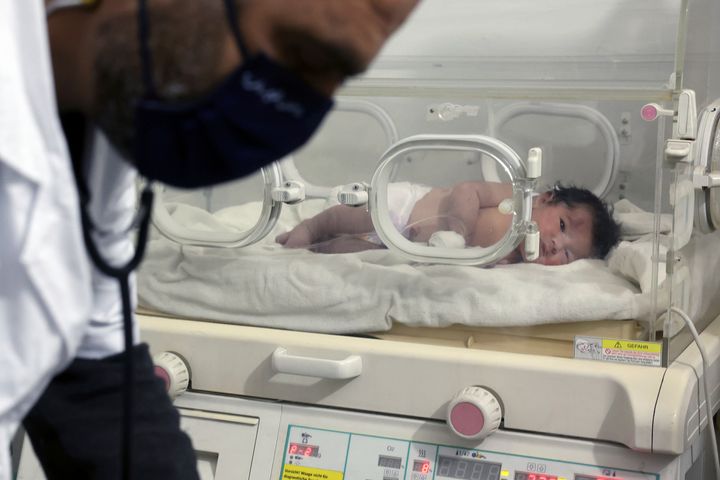 Residents discovered the crying infant whose mother appeared to have given birth to her while buried underneath the rubble of a five-story apartment building leveled by this week’s devastating earthquake.