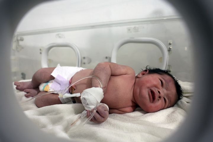 A baby girl who was born under the rubble caused by an earthquake that hit Syria and Turkey receives treatment inside an incubator at a children's hospital in the town of Afrin, Aleppo province, Syria, on Feb. 7, 2023. 