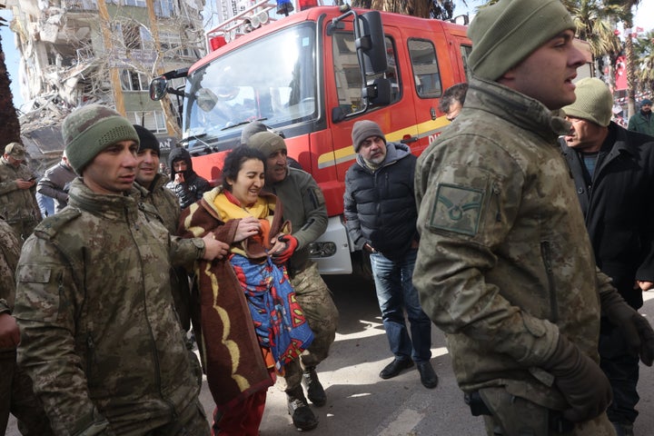 Medine Inci, another survivor, after she was rescued from under rubble alive