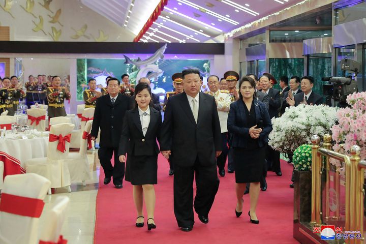In this photo provided by the North Korean government, North Korean leader Kim Jong Un, center, with his wife Ri Sol Ju, right, and his daughter attend a feast to mark the 75th founding anniversary of the Korean People’s Army at an unspecified place in North Korea on Feb. 7, 2023. Independent journalists were not given access to cover the event depicted in this image distributed by the North Korean government. The content of this image is as provided and cannot be independently verified. Korean language watermark on image as provided by source reads: "KCNA" which is the abbreviation for Korean Central News Agency.