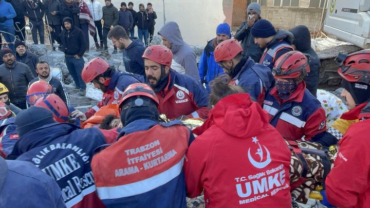 An injured person is rescued from under rubble in Adiyaman, Turkey, on Feb. 8, 2023. 