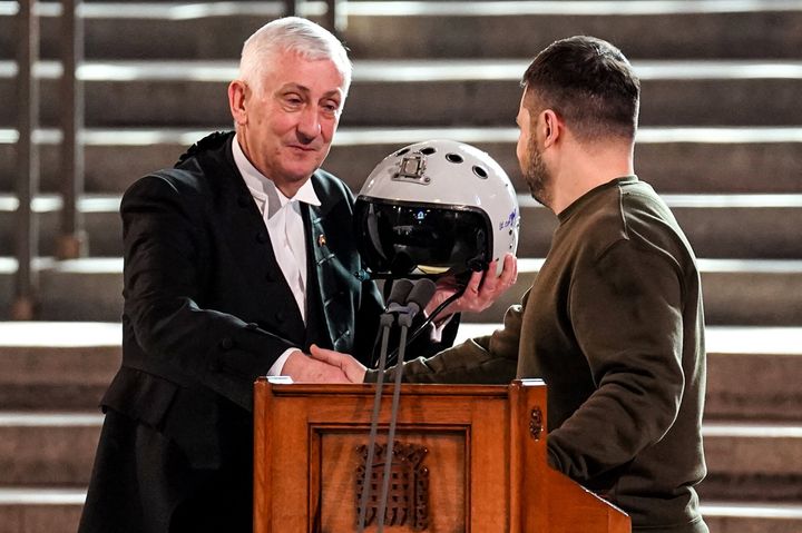 Hoyle holds the helmet of one of the most successful Ukrainian pilots, inscribed with the words "We have freedom, give us wings to protect it", presented to him by Zelenskyy