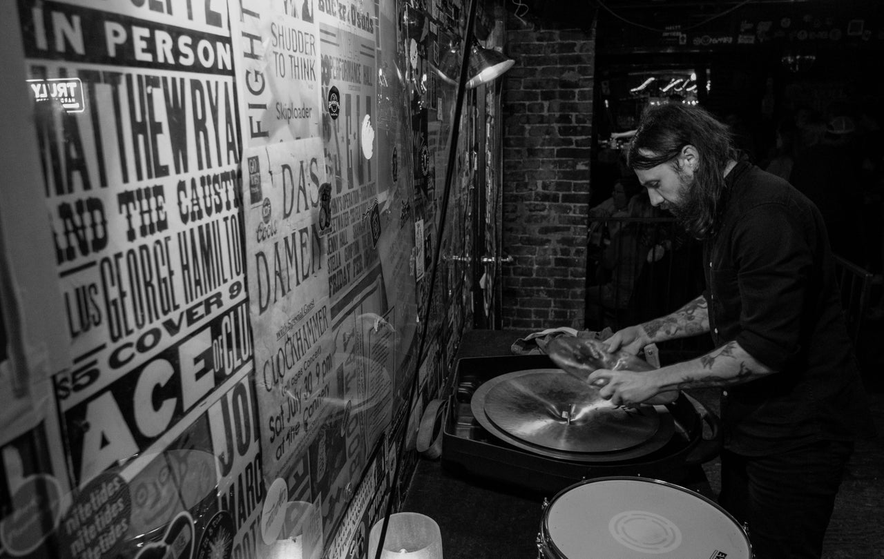 Austin Wright puts his drum kit away after a show at The Basement.