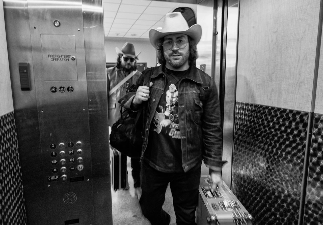 Gaultier (center) and Dawn enter an elevator in Chattanooga.