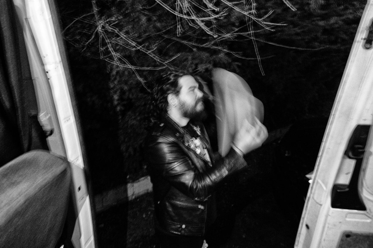 Dawn puts on his cowboy hat before a show in Louisville, Kentucky.