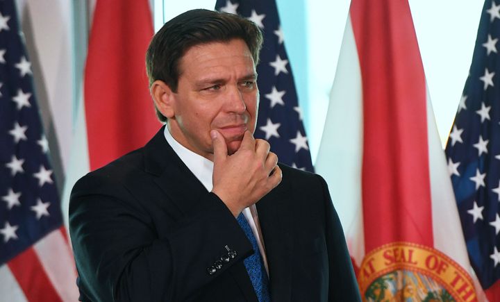 Florida Gov. Ron DeSantis at a press conference at the SunTrax Test Facility in Auburndale, Florida. The Republican governor's “anti-woke” agenda has led to censorship, including book challenges and eliminating classes that take on the reality of a racialized society. And educators are bearing the brunt of it.