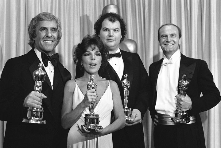 Burt Bacharach, left, Carole Bayer Sager, Christopher Cross and Peter Allen, right, accept their Oscars after receiving the award for best achievement in music in connection with motion pictures (original song) during the 54th annual academy awards presentation in Los Angeles on March 29, 1982. The quartet was honored for music and lyrics to ?Arthur?s Theme.? (AP Photo)