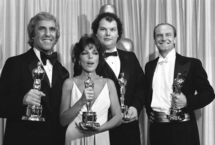 Burt Bacharach, left, Carole Bayer Sager, Christopher Cross and Peter Allen, right, accept their Oscars after receiving the award for best achievement in music in connection with motion pictures (original song) during the 54th annual academy awards presentation in Los Angeles on March 29, 1982. 