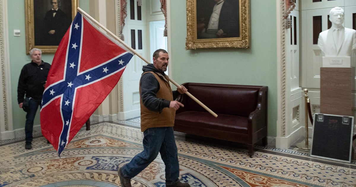 NextImg:Rioter Who Paraded Confederate Flag Through U.S. Capitol On Jan. 6 Sentenced