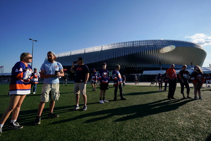 New York Islanders fans gather outside Nassau Coliseum before Game 3 of the team's NHL hockey Stanley Cup semifinals against the Tampa Bay Lightning on June 17, 2021.