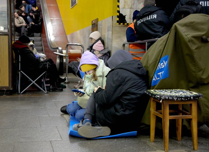 Ukrainian citizens take shelter inside a metro station during a rocket attack in Kyiv, Ukraine on February 10, 2023.
