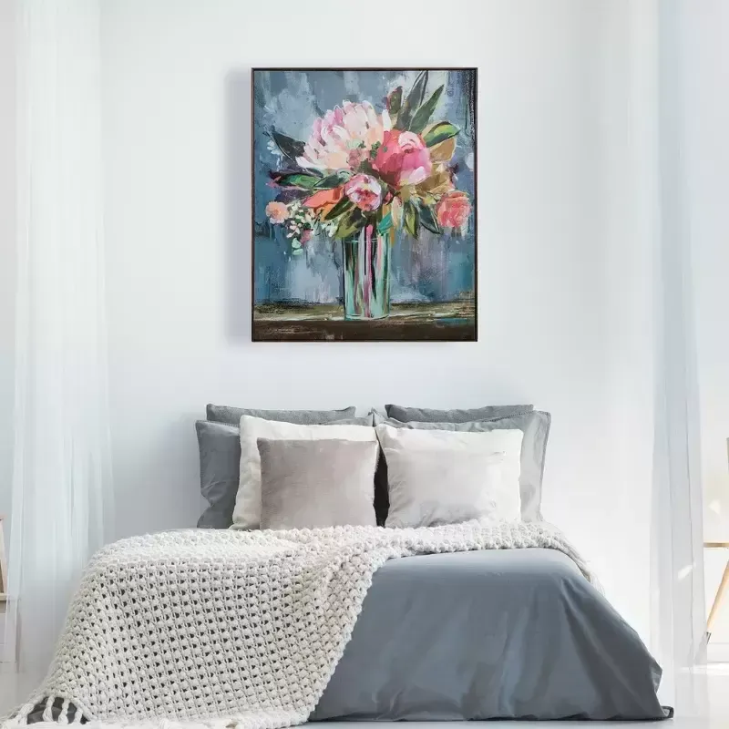 A framed floral canvas