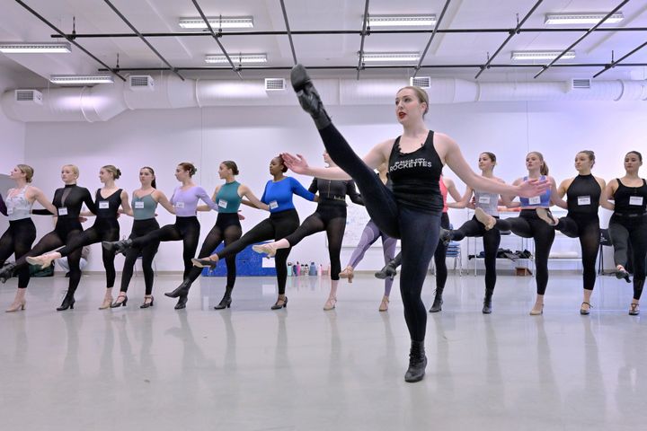 Amarisa LeBar, front, a Radio City Rockette, leads students in a Rockettes Precision Dance Technique course Wednesday, Feb. 8, 2023, at the Boston Conservatory at Berklee in Boston. (AP Photo/Josh Reynolds)