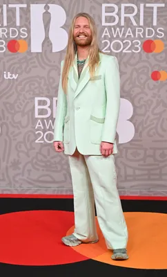 Harry Styles Peplum Suit and Dyed Hair at the Brits 2023